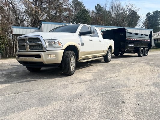 Pickup truck towing the dump trailer