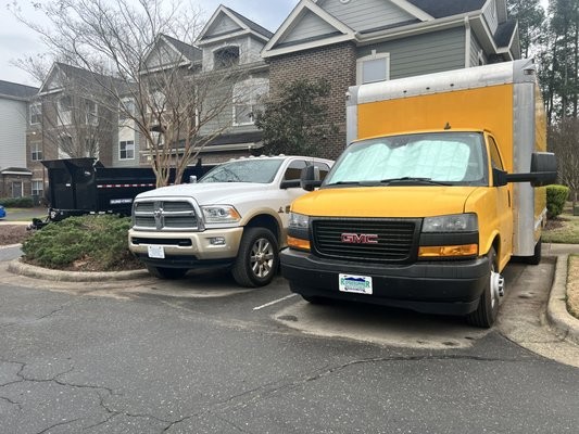 Side view of the yellow moving box truck